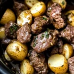 crockpot garlic butter beef bites with potatoes